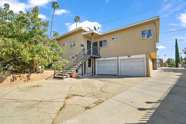 rear view of house with a garage