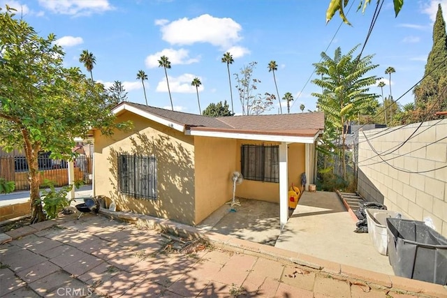 rear view of house featuring a patio