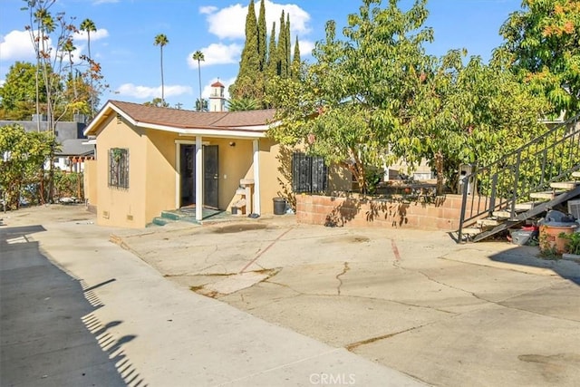 rear view of house featuring a patio area