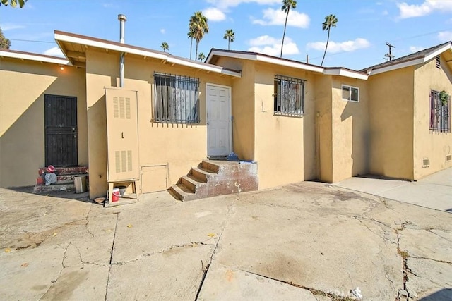 rear view of house featuring a patio area