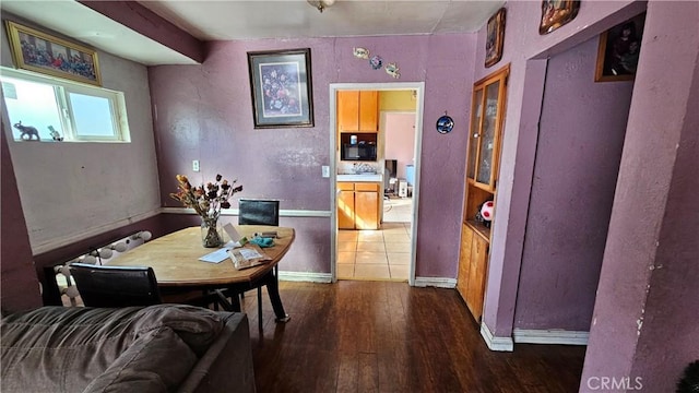 dining room featuring dark wood-type flooring