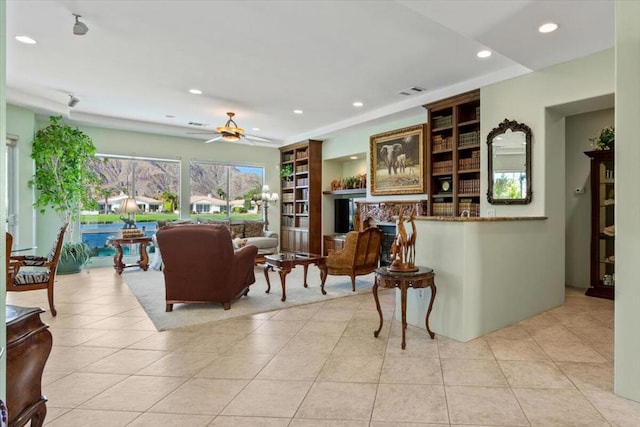 tiled living room featuring ceiling fan