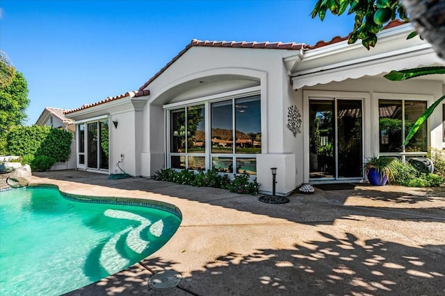 rear view of house featuring a patio