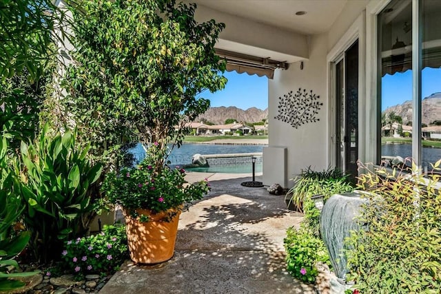 view of patio / terrace featuring a water view