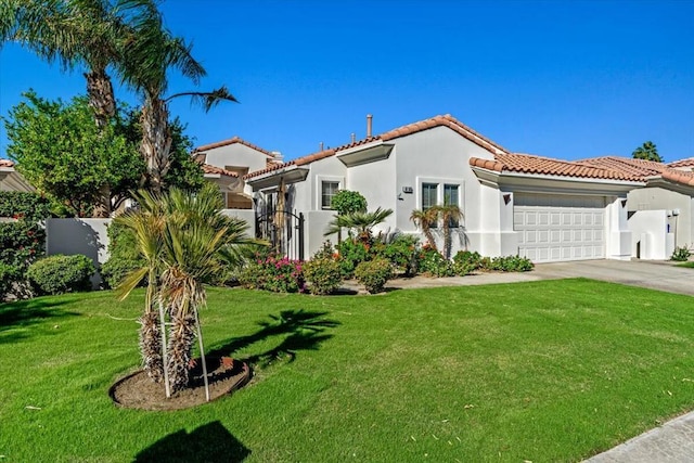 mediterranean / spanish home featuring a garage and a front lawn