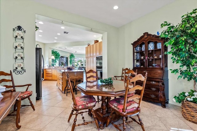 dining space with light tile patterned floors