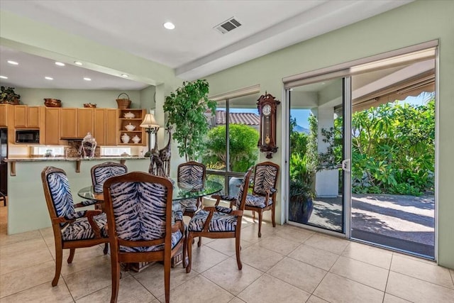 dining area with light tile patterned floors