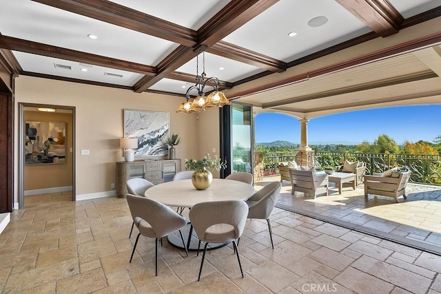 dining space with beam ceiling, crown molding, a mountain view, and a notable chandelier