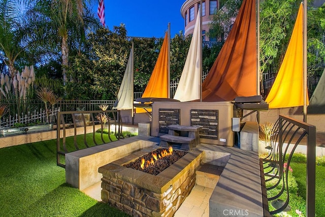 view of patio / terrace with a fire pit