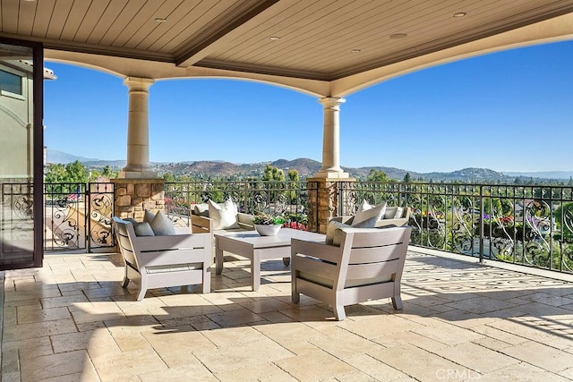 view of patio with outdoor lounge area and a mountain view