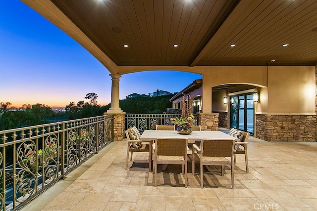 view of patio terrace at dusk