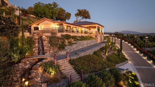 mediterranean / spanish home featuring a mountain view