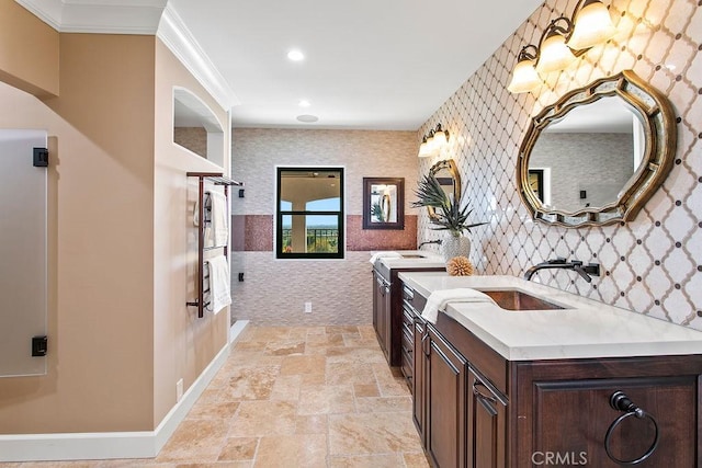 bathroom with vanity and crown molding