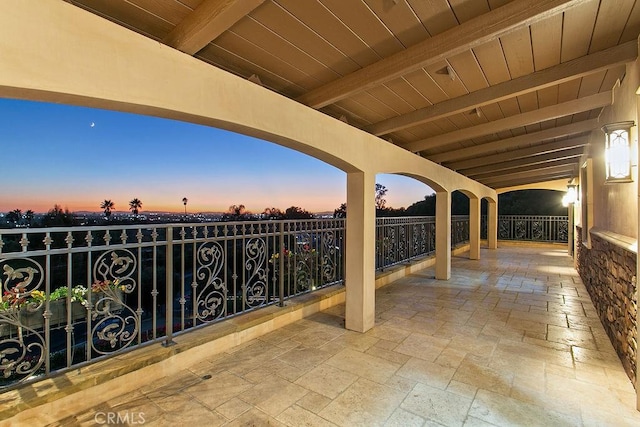 patio terrace at dusk with a balcony