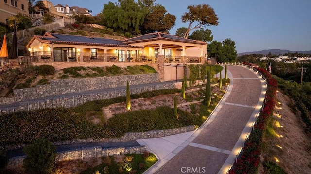 view of front of property with solar panels