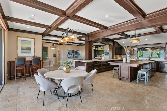 dining room featuring crown molding, beamed ceiling, a chandelier, and coffered ceiling