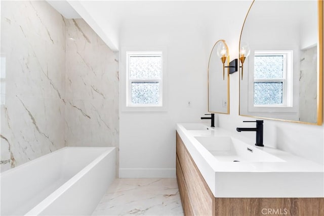 bathroom featuring vanity and tiled shower / bath