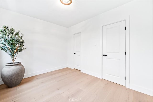 empty room with light wood-type flooring