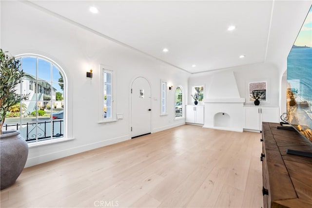 entryway with light hardwood / wood-style floors and plenty of natural light