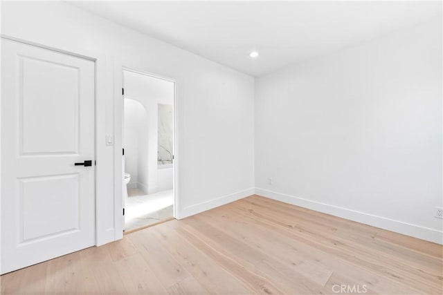 spare room with light wood-type flooring