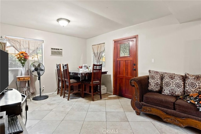 dining space featuring light tile patterned floors and a wall unit AC