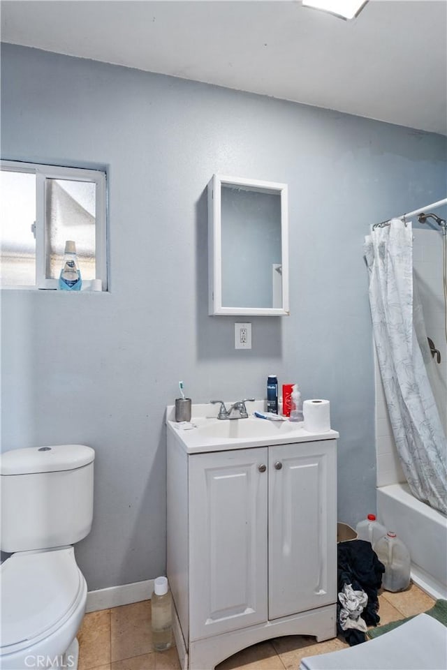 full bathroom with toilet, shower / bath combo with shower curtain, tile patterned floors, and vanity