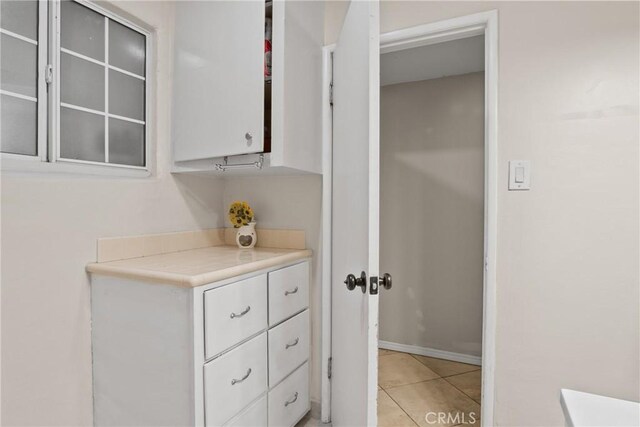 bathroom with tile patterned floors