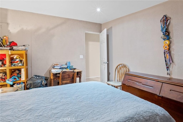 bedroom with wood-type flooring