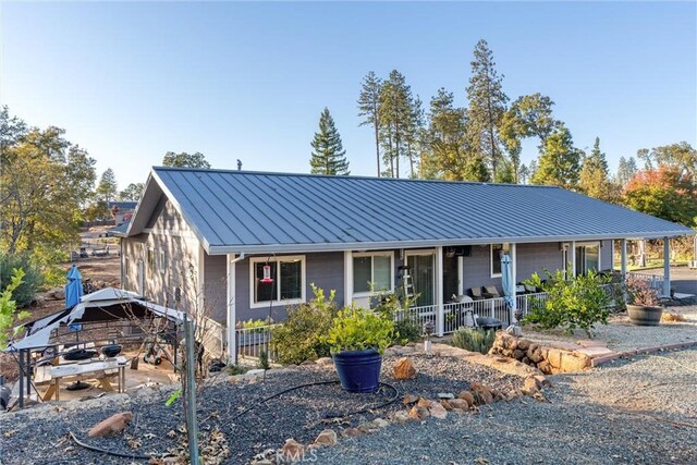 1486 Magadon Rd, Paradise, CA 95969 - view of front of home with a standing seam roof, a porch, and a metal roof