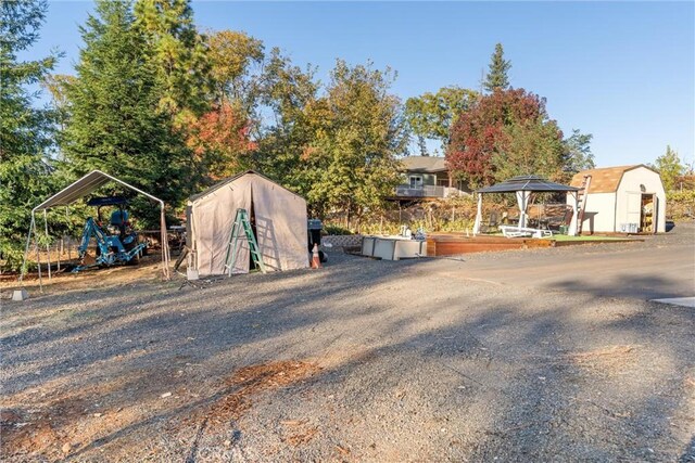 1486 Magadon Rd, Paradise, CA 95969 - view of yard with a storage unit, a gazebo, and a carport