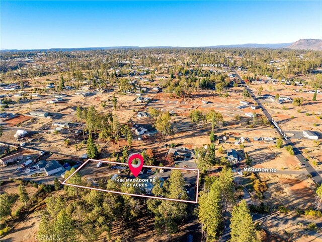 1486 Magadon Rd, Paradise, CA 95969 - aerial overview of property's location with property boundaries highlighted and a mountain backdrop