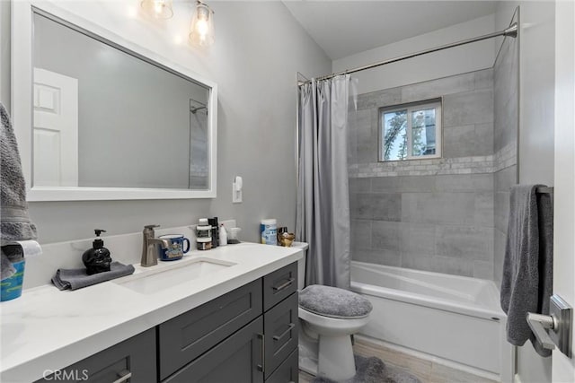 full bathroom with hardwood / wood-style floors, shower / bath combo, toilet, and vanity