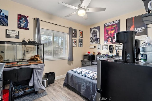 bedroom featuring ceiling fan and light wood-type flooring