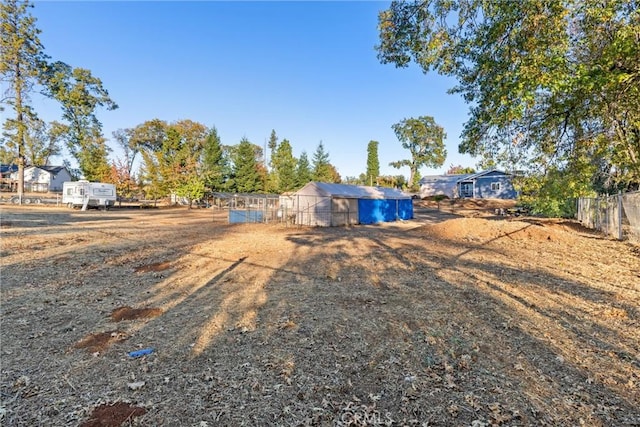 view of yard with an outdoor structure