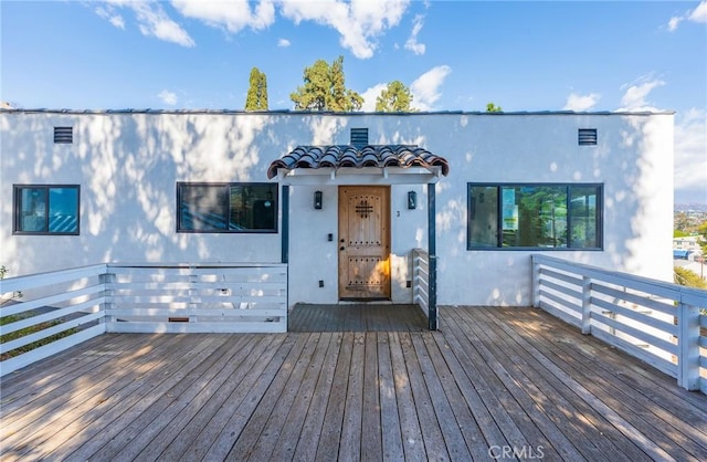 view of front of property with a wooden deck