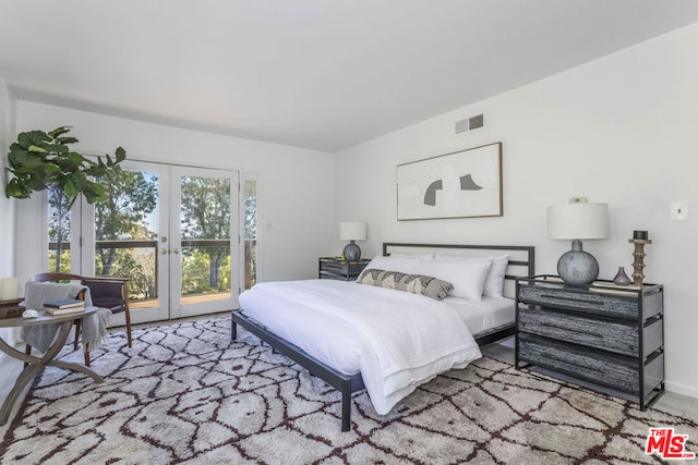 bedroom with access to outside and french doors