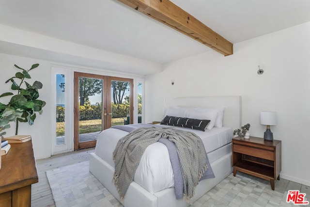 bedroom with beam ceiling, access to exterior, french doors, and light hardwood / wood-style floors