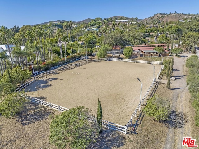 birds eye view of property with a mountain view