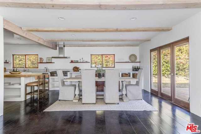 dining space featuring beam ceiling, dark hardwood / wood-style floors, french doors, and sink