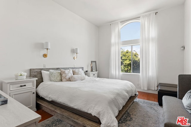 bedroom featuring dark hardwood / wood-style floors