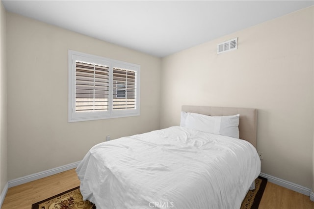 bedroom featuring hardwood / wood-style flooring