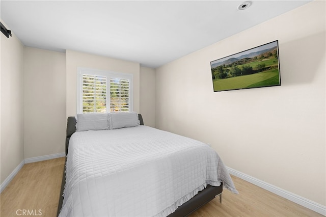 bedroom with light hardwood / wood-style floors