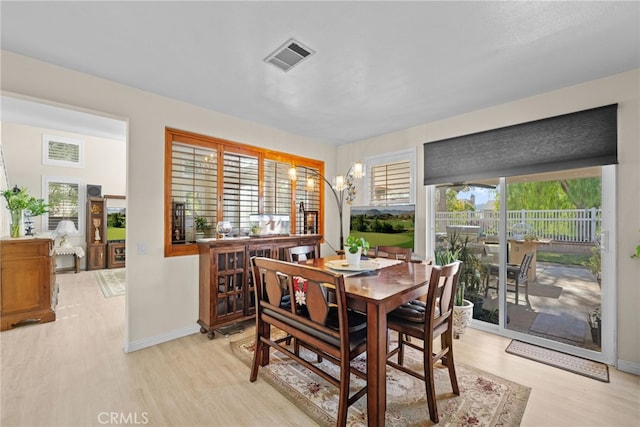 dining space featuring light hardwood / wood-style flooring