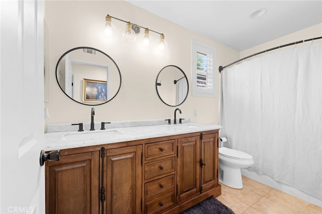 bathroom featuring tile patterned flooring, vanity, a shower with shower curtain, and toilet