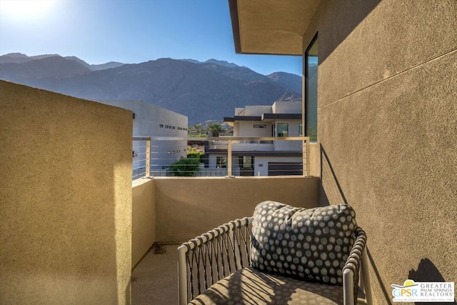 balcony featuring a mountain view