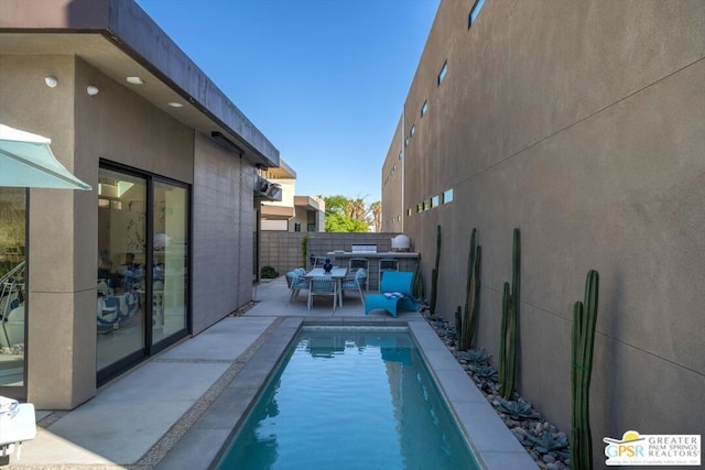 view of swimming pool featuring a patio