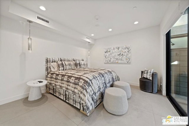 bedroom with light tile patterned floors