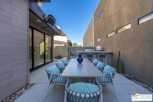 view of patio featuring exterior kitchen