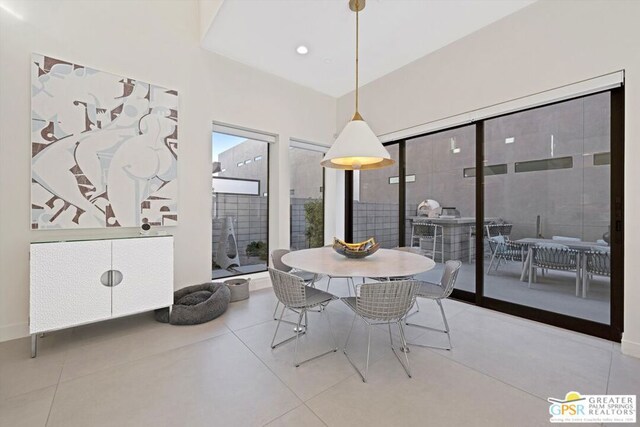 dining space with light tile patterned flooring