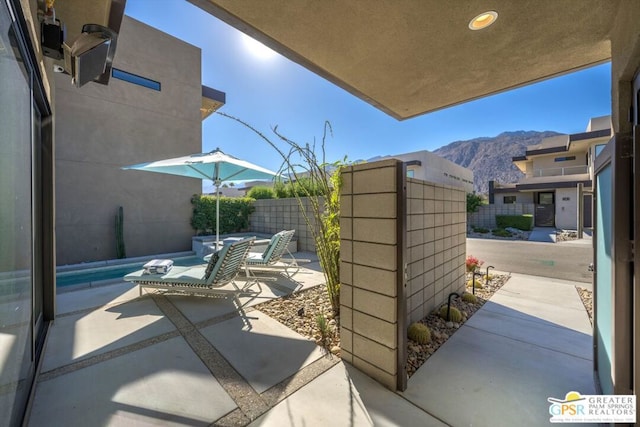 view of patio with a mountain view